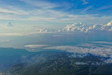 Naklejka premium Epic panoramic view from the top of Mount Inerie on Fores, the view a green valley surrounded by a sea of clouds.