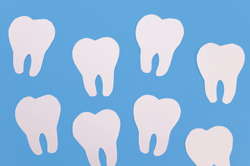 White paper teeth on a blue background, background, texture