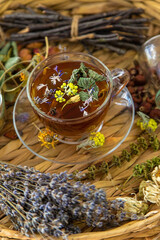 Herbal tea with medicinal herbs and flowers. Selective focus.