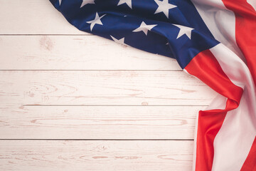 Part of the American flag is on a wooden table