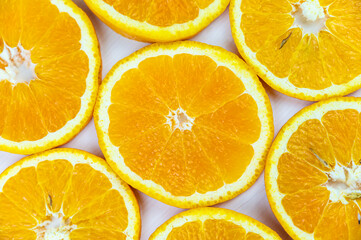 Orange slices close together and on a white background. Orange pulp.