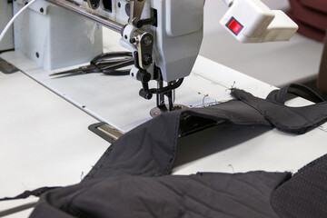 A photo of a sewing machine and trim parts in the process of being repaired