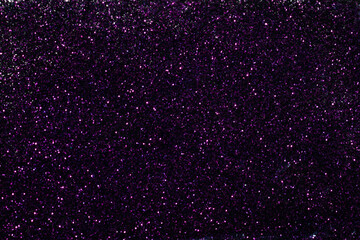 Dark purple glitter sparkle background texture. Scattered abstract background for any celebration