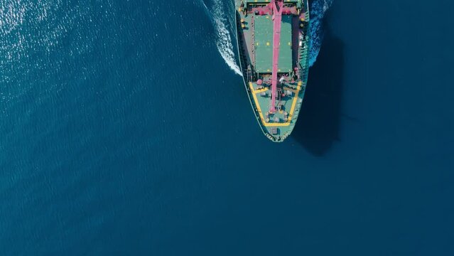 Forecastle of cargo bulker ship cruising in sea, Aerial top dow view