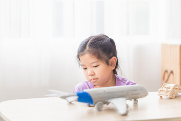 Asian child girl playing in living room, Kid girl playing with toy at home