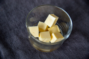 cubes on a table, butter cubes in a glass, dairy