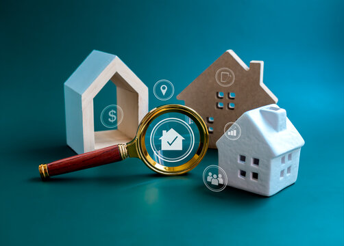 House online search, Property value, home buying and selling, real estate investment concepts. Home and and valuable research icons in magnifying glass with three types of house on blue background.