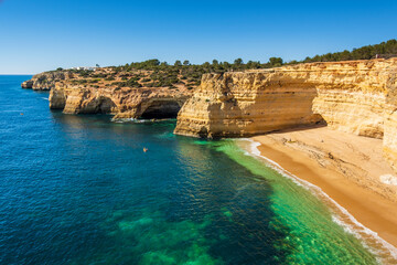 Beautiful cliffs and rock formations at Cao Raivoso Beach in Algarve, Portugal