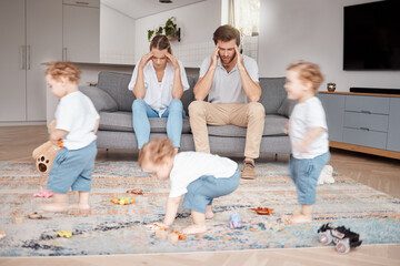 Parents, stress and busy with an adhd child running around a home living room with energy or motion...