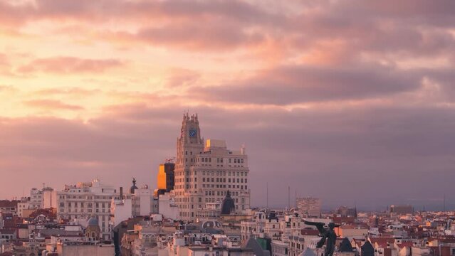 Madrid Telefonica building timelapse against colorful cloudy sky during sunset