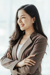 Asian businesswoman in formal suit in office happy and cheerful during using smartphone and working