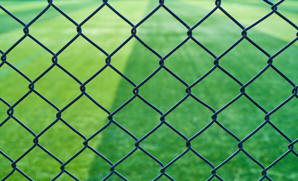 Barbed wire fence outside a football field