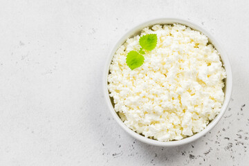 Cottage cheese in a bowl. Top view, copy space, flat lay.