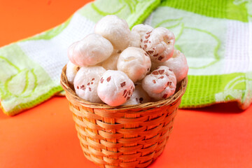 Organic Crispy Lotus pops Seeds or Phool Makhana served in a wooden bowl on background.