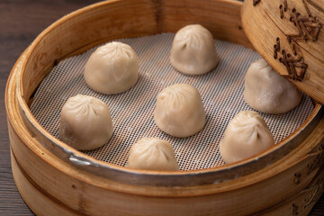 Steamed pork soup dumplings named Xiao long bao in Taiwan.
