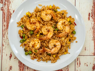 fried rice with shrimps on white plate	

