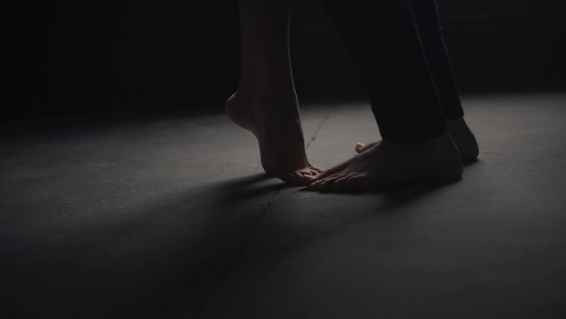 Man and woman legs on the floor. Couples feet near each other, close up. Good morning. Kissing and romantic concept. Happy valentines day.