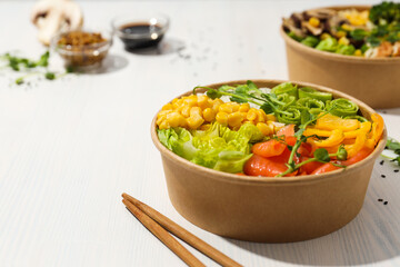 Bowls with tasty and nutritious food, space for text