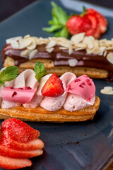 Set of french dessert eclairs with colorful topping