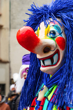 Basel Fasnacht, street costume carnival with flutes, drummers and confetti, people and children in masks