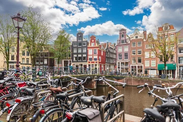 Foto op Plexiglas Typical Dutch facade along the canals, with many bicycles, in Amsterdam, Holland, Netherlands © FredP