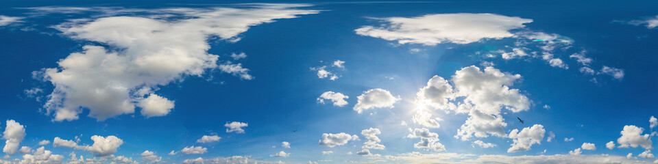 Blue sky panorama with puffy Cumulus clouds. Seamless hdr pano in spherical equirectangular format. Sky dome or zenith for 3D visualization, game and sky replacement for aerial drone 360 panoramas.