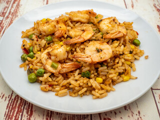 fried rice with shrimps on white plate	