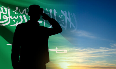 Silhouette of a saluting soldier against the sky and Saudi Arabia flag. Concept - Armed Force of Saudi Arabia. EPS10 vector