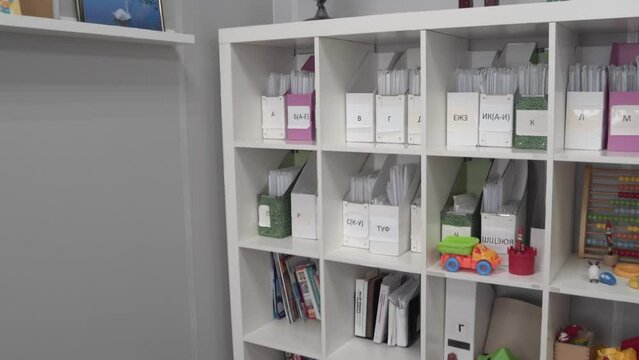 A cabinet with shelves with documents of patients in the medical clinic. Registration in a children's polyclinic.