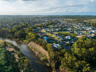 Housing area of town overlooking cliff and River in afternoon light