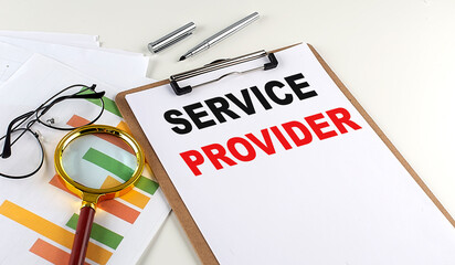 SERVICE PROVIDER text on clipboard with chart on white background, business concept