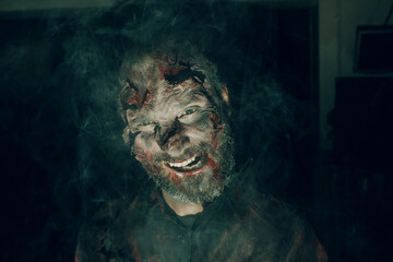 Zombie male makeup for halloween concept. Make up skin and blood face