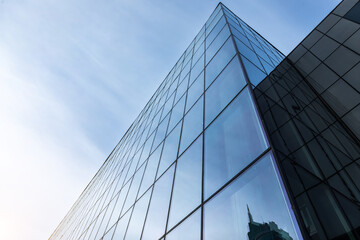 Glass office building exterior against the sky - obrazy, fototapety, plakaty
