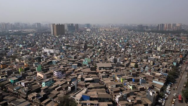 Aerial view of residential buildings in the crowded Govandi neighbourhood in the the suburbs of Mumbai, Maharashtra, India, population growth, poverty and overpopulation concept.