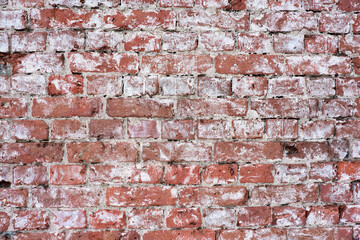 Textured old red brick wall. Close-up of the texture of an old brick wall.