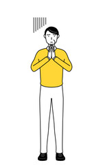 体の前で手を合わせて謝る定年退職したシニア・中年男性