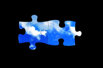 Two connected jigsaw puzzle pieces with blue sky. Solving tasks, teamwork, partnership and connection or environmental concept