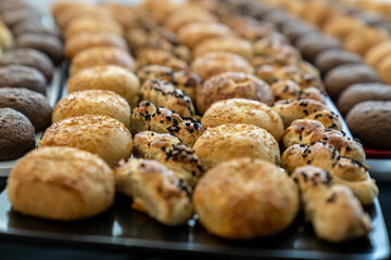 coffee break hotel during conference meeting, corporate revent with tea and coffee catering, decorated catering banquet table with variety of different pastry and bakery, with croissants and cookies