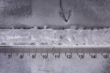 Crack steel butt weld carbon background white contrast