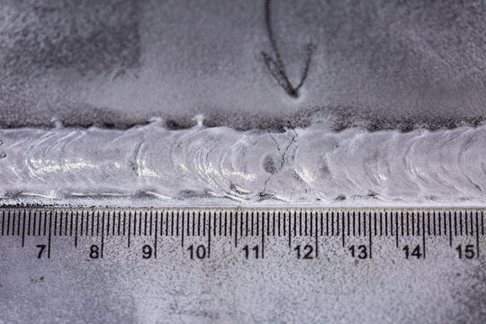 Crack steel butt weld carbon background white contrast