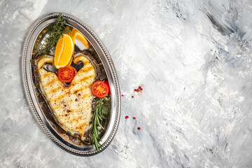 Grilled fish in plate. superfood concept. Healthy, clean eating. top view