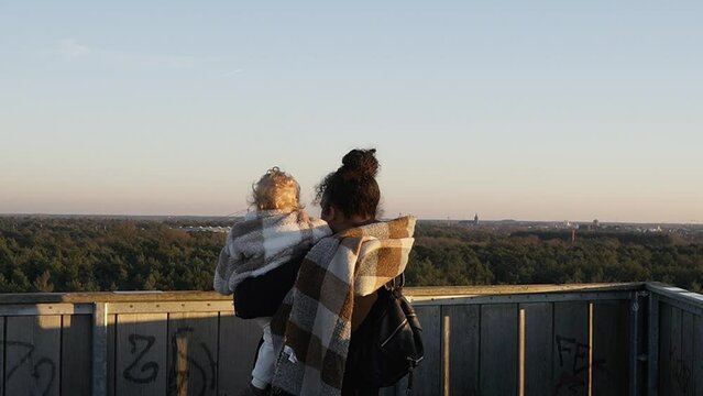 Woman and baby enjoying the view on the observation tower in Lommel, Belgium.