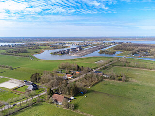Obraz premium aerial shot above oldambt early spring with sunny wheater with lake, water and blue sky