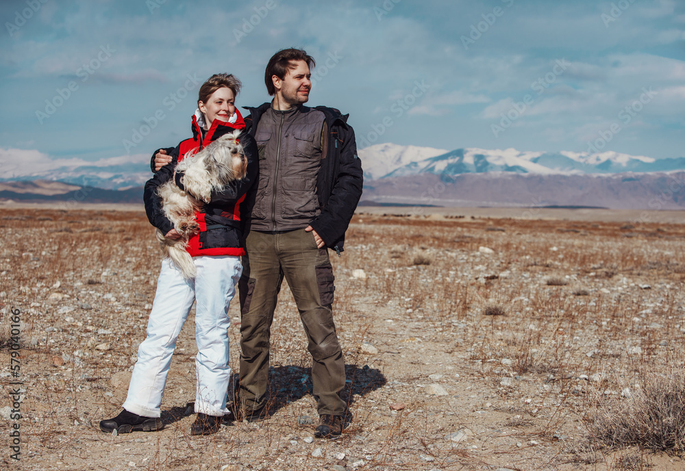 Sticker Man and woman with shih tzu dog standing on mountains background at winter season