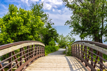 Fototapeta na wymiar The LaSalle Marina foot bridge of Burlington, Ontario in summer.