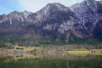 Bad Goisern, Austria - March 2023: Beautiful city view. Mountain Lake. Lake among the mountains. Huts in the mountains near the forest lake.