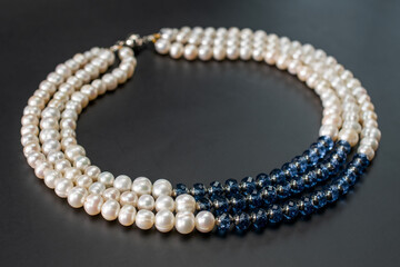 Colorful gemstone crystal beads necklace on black, unique handmade jewelry background