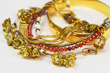 Massive crystal gemstones bracelets, bangles and chains background, old vintage jewelry concept, promotional photo for an online jewelry store