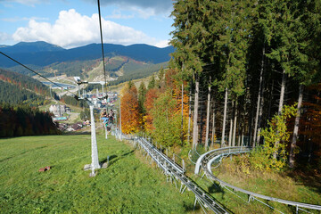 People on ski lift in Bukovel village, largest ski resort in Carpathians