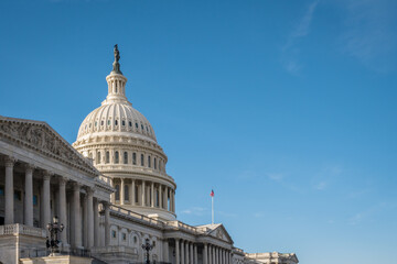 United States Capitol Dome with bright blue sky in background with copy space.